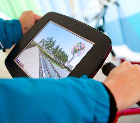 Olympic Park visitors take a virtual tour on Bouncepad Bikes